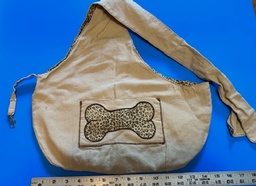 Pet carrier bag with bone applique on pocket