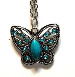 Silver filigree butterfly with blue gems and turquoise
